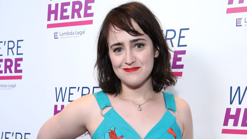 Mara Wilson wearing a turquoise top