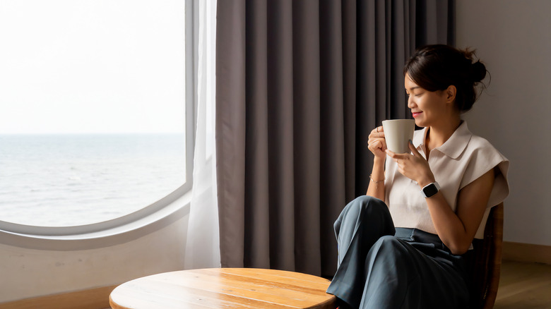 Asian woman sipping tea