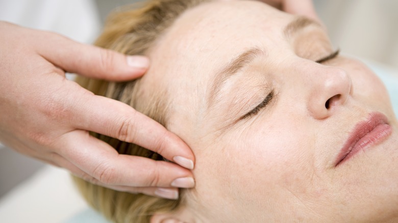 Woman getting a facial massage