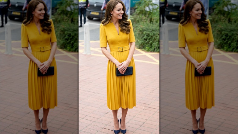 Kate Middleton smiling in yellow dress