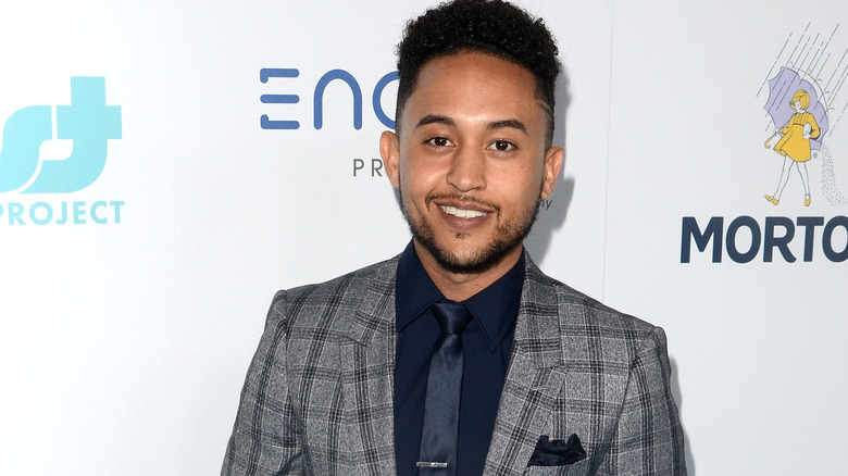 Tahj Mowry in a gray suit 