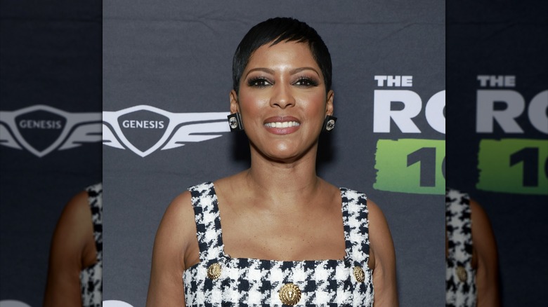 Tamron Hall smiling in black and white dress