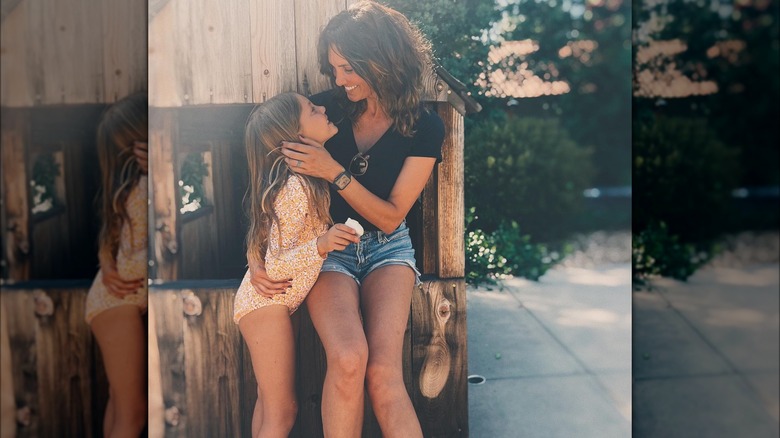 Daniela Ruah holding her daughter Sierra