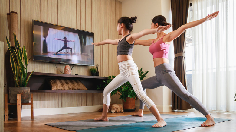 Practicing yoga at home via video