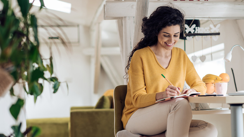 woman writing a list