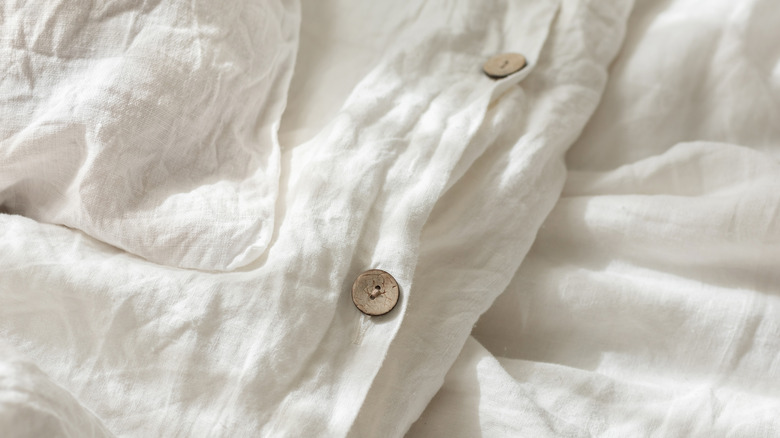 wrinkled white shirt