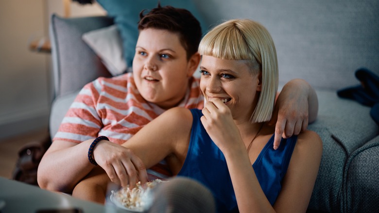 Gay couple watching show together