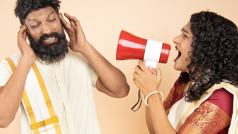 Woman yelling at man