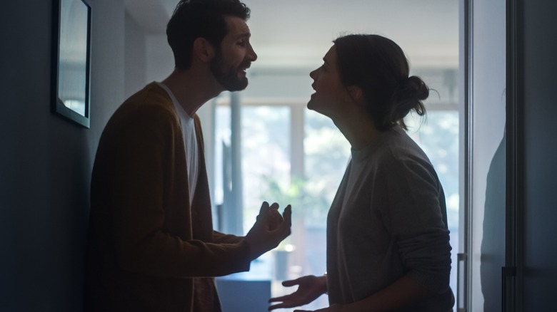 Silhouette of couple fighting 