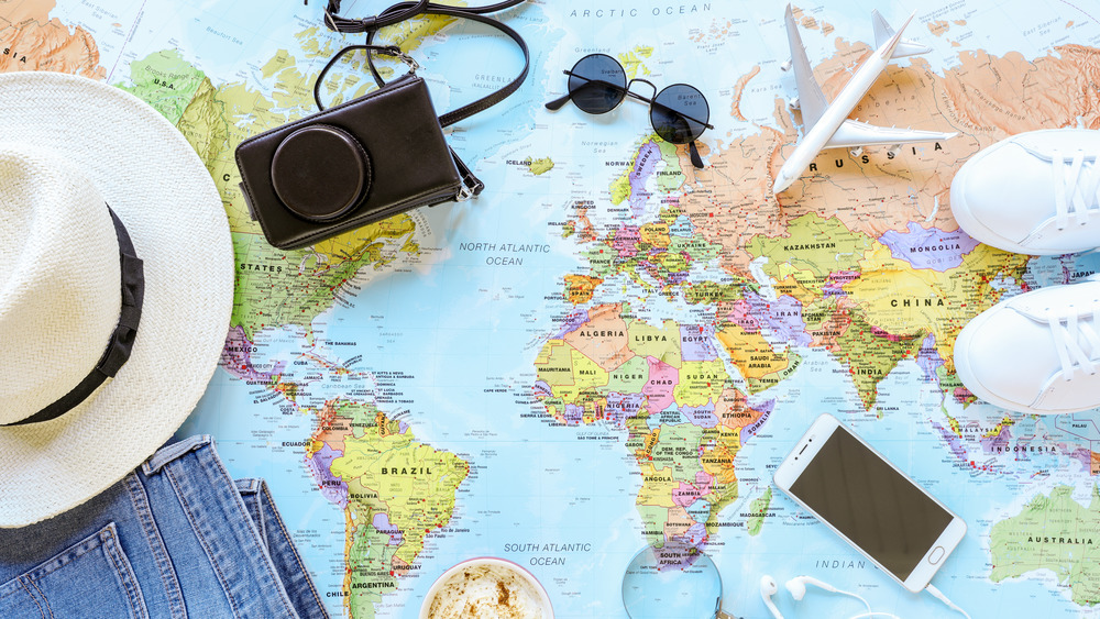 Traveling accessories on a world map  