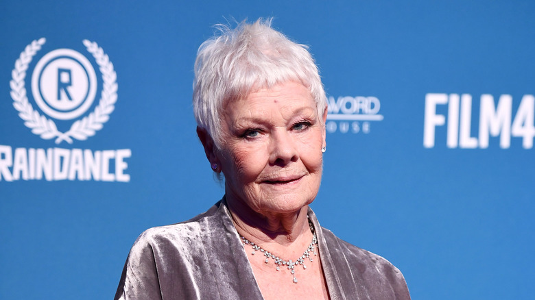 Dame Judi Dench posing on the red carpet