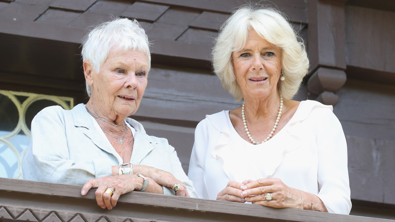 Camilla Parker Bowles and Judi Dench on a balcony