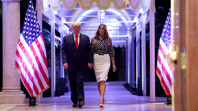 Donald and Melania Trump walking