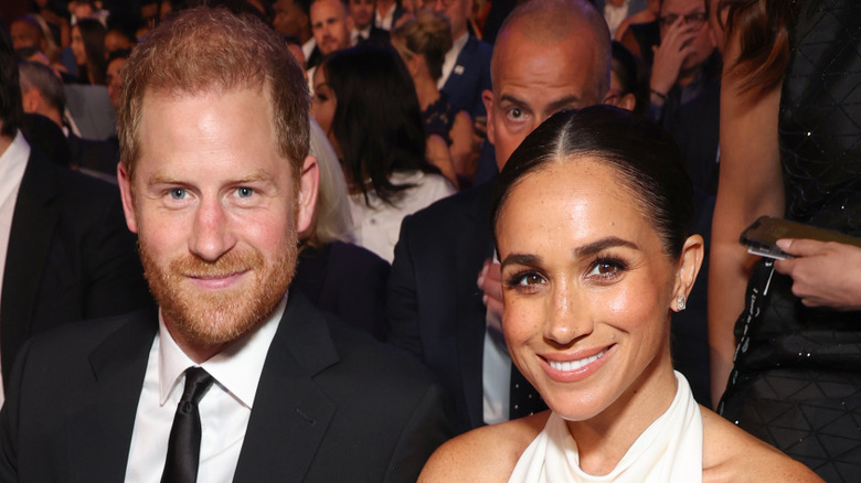 Prince Harry and Meghan Markle smiling