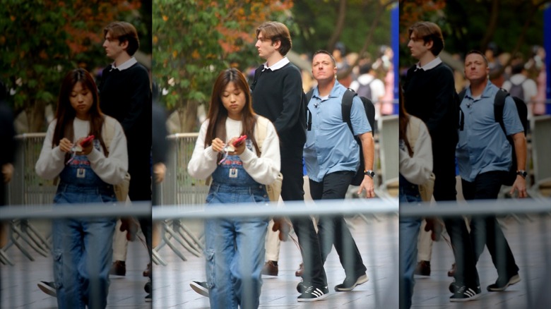 Barron Trump steps out from his college campus, marking a rare public sighting just days before the upcoming election.