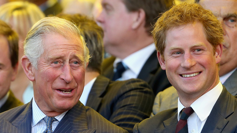 Prince Charles and Prince Harry smiling