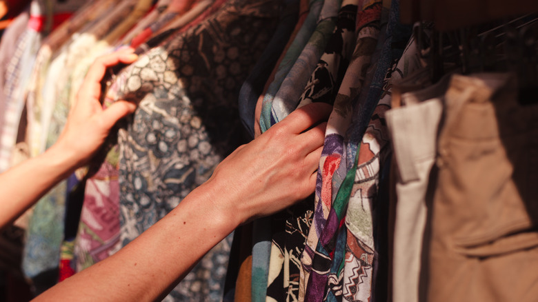 woman shopping secondhand clothing