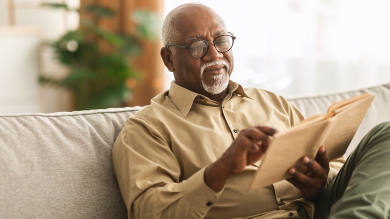 older man reading book