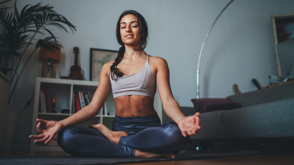 Woman doing yoga at home