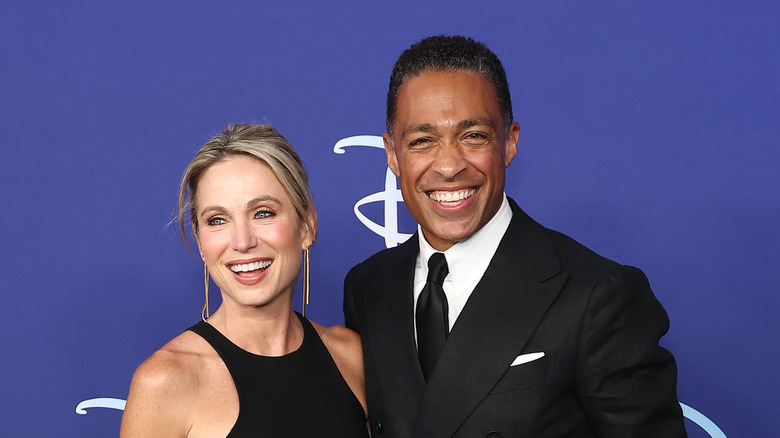 Amy Robach and T.J. Holmes smiling