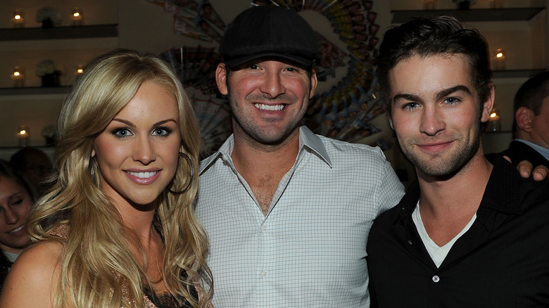 Candice Crawford, Tony Romo, and Chace Crawford smiling and posing together