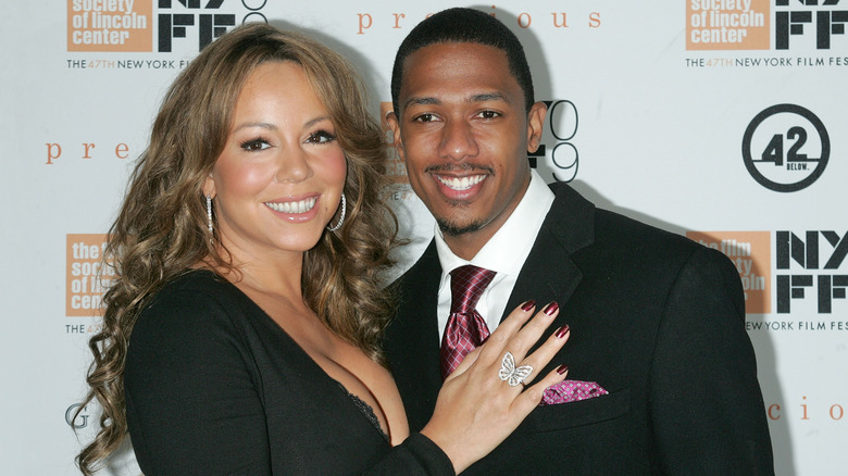 Mariah Carey and Nick Cannon standing together