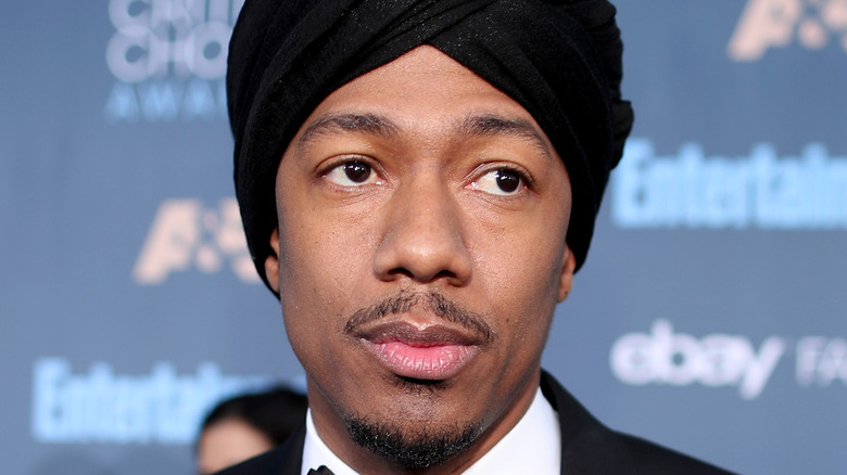 Nick Cannon looks worried in a turban