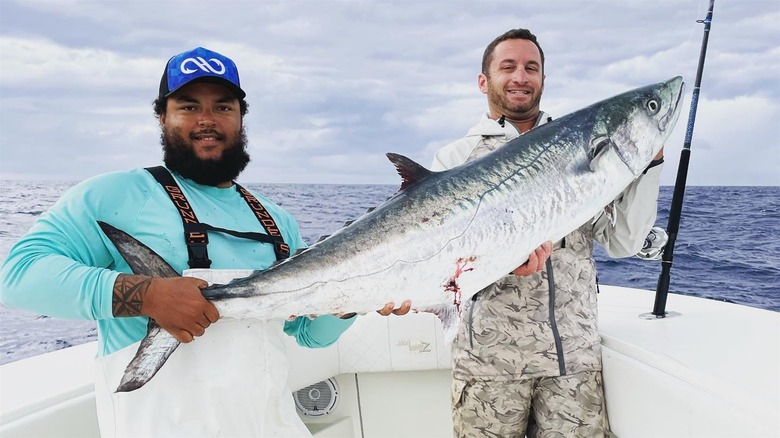 Connor Cruise holding a giant fish