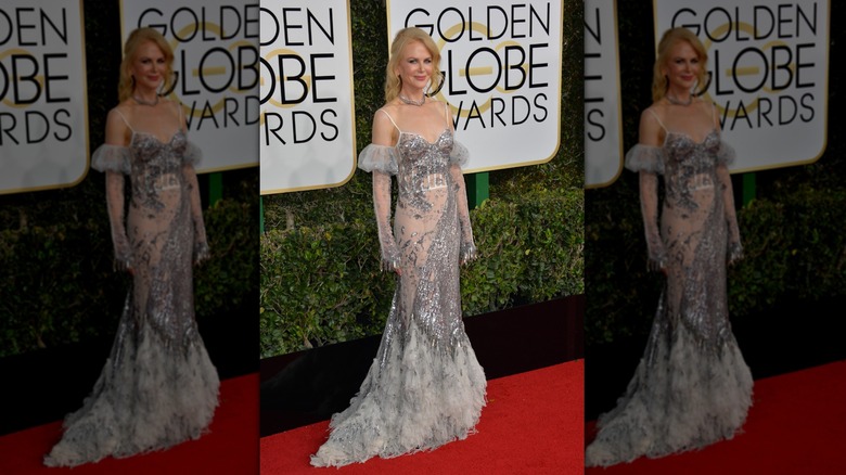 Nicole Kidman posing in a metallic Alexander McQueen gown the 2017 Golden Globes