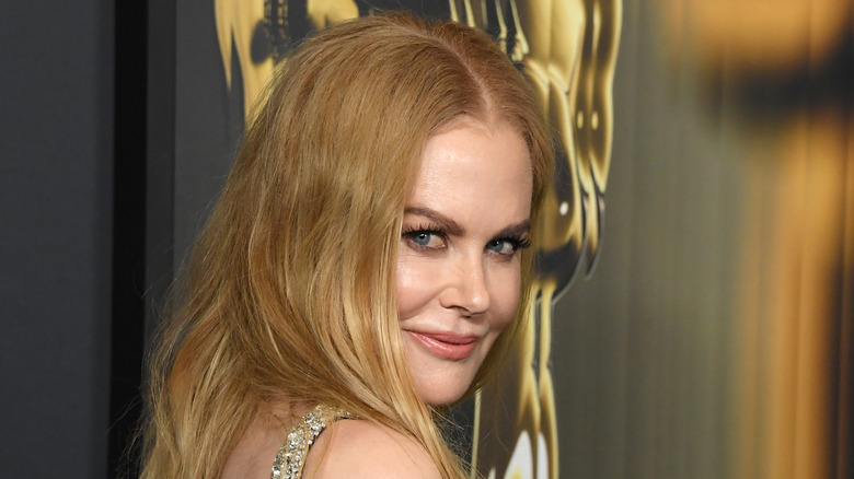 Nicole Kidman looking sideways while smirking