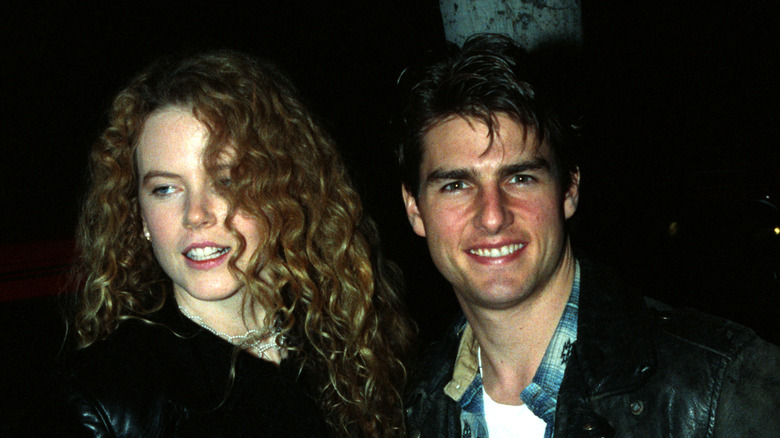 Tom Cruise smiling alongside Nicole Kidman