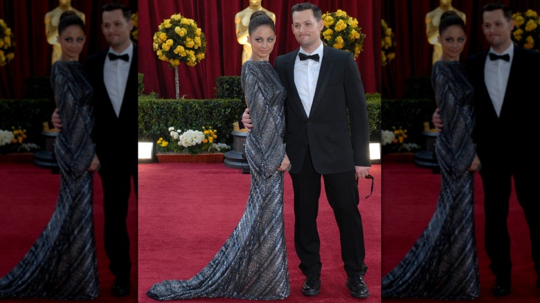 Nicole Richie in a floor-length beaded gown on the red carpet with Joel Madden