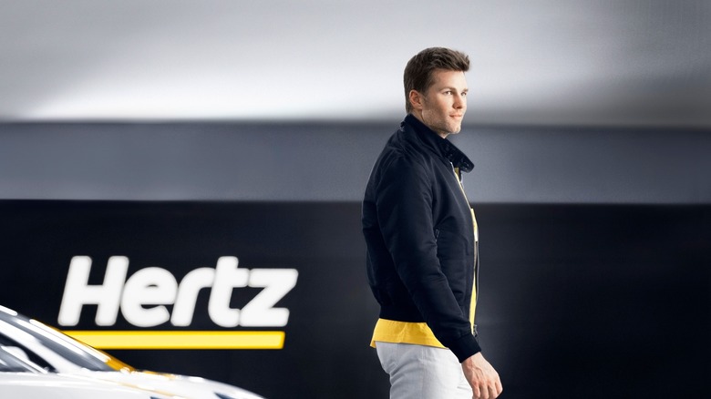 Tom Brady walking in Hertz garage