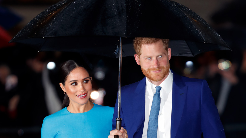 Prince Harry and Meghan Markle wearing blue