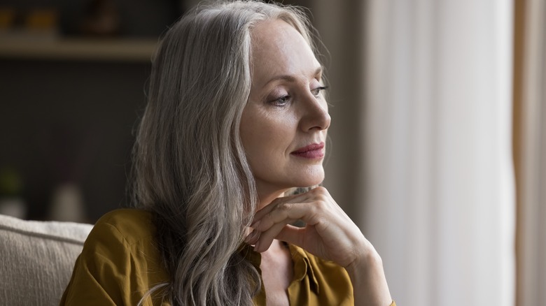 A woman looking lost in thought. 