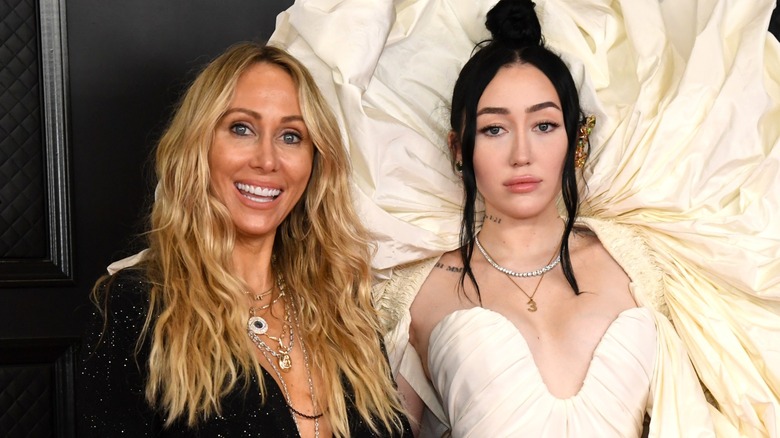 Tish Cyrus smiling, Noah Cyrus posing