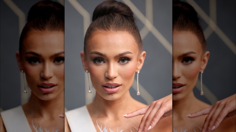 Close up of Noelia Voigt with hair in bun wearing white