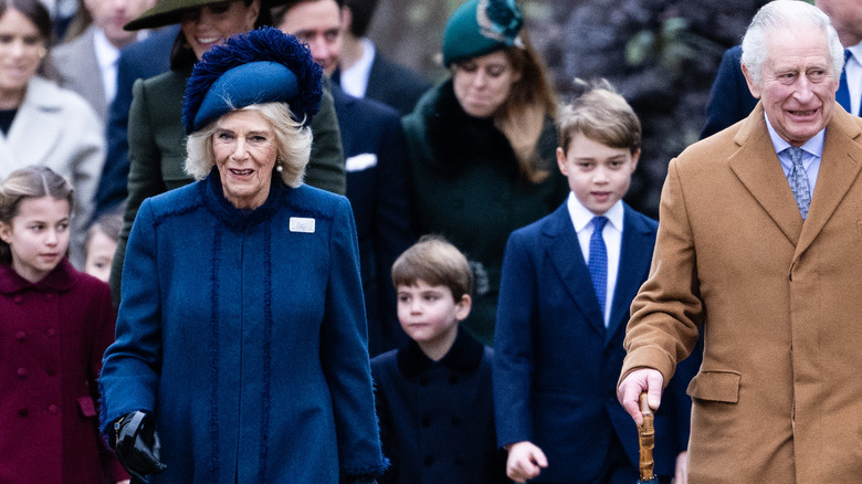 The royal family walking outside