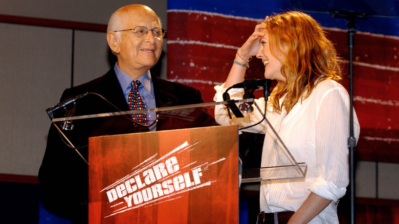 Norman Lear and Drew Barrymore at a rally