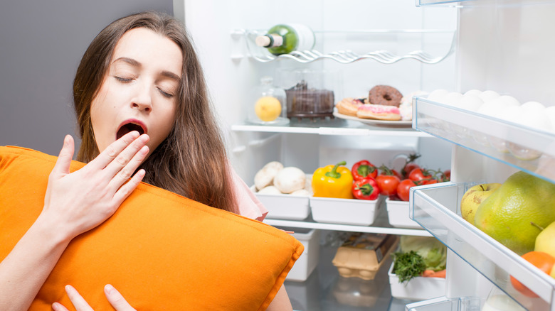 yawning woman getting midnight snack