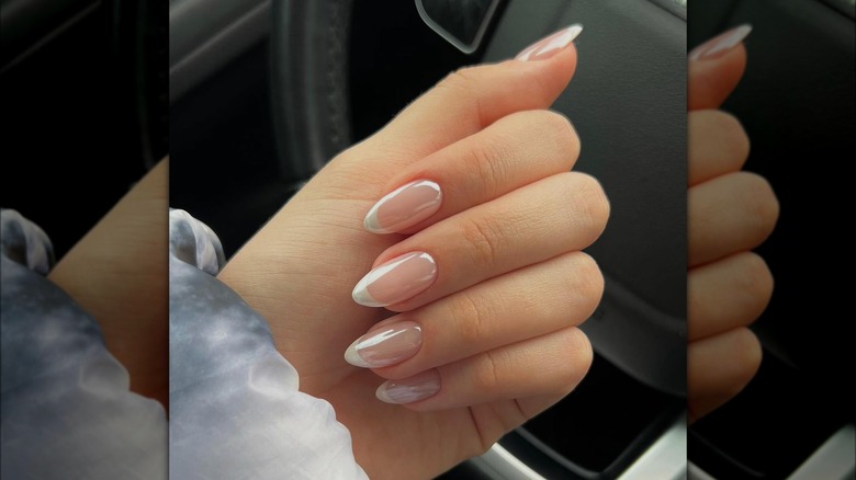 Hand showing almond-shaped French tips with 