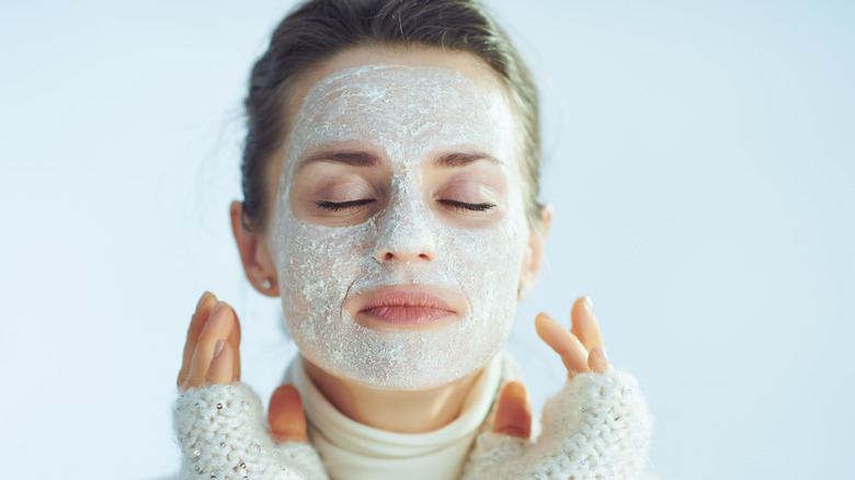 Woman with facial mask on, eyes closed