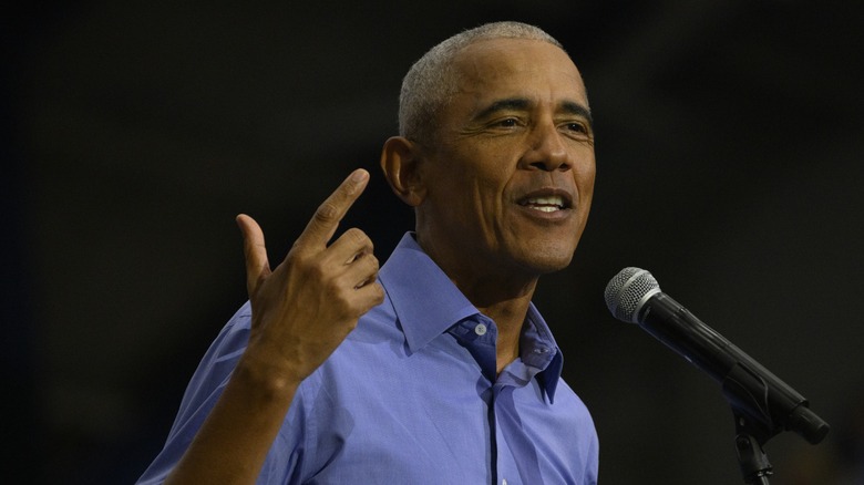 Barack Obama smiling at podium