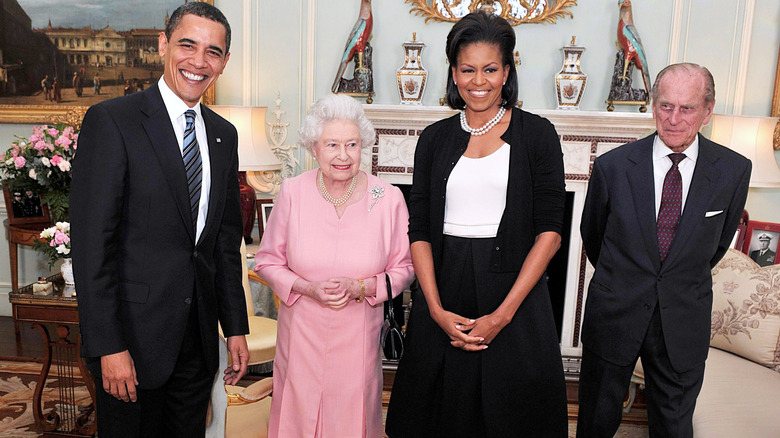 Queen Elizabeth and Prince Philip posing with the Obamas