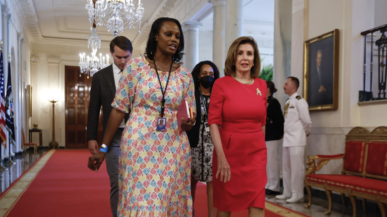 Nancy Pelosi walking in White House