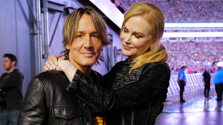 Nicole Kidman with her arms around husband Keith Urban