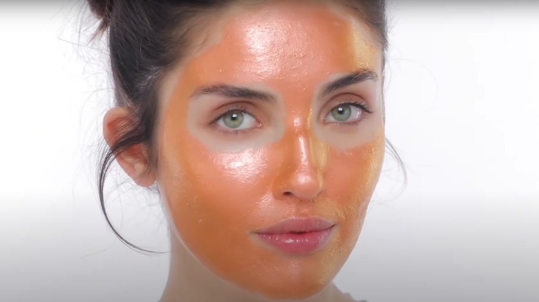 woman with orange face mask