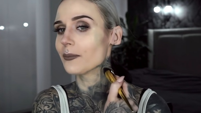 Woman covering tattoos