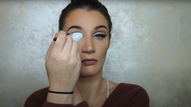 Brittney Foley using a spoon to create a cut crease