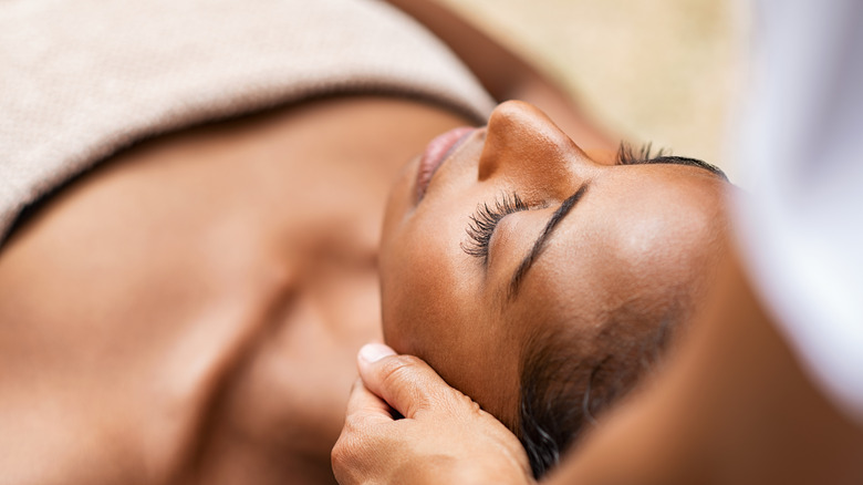 pretty woman relaxes during massage